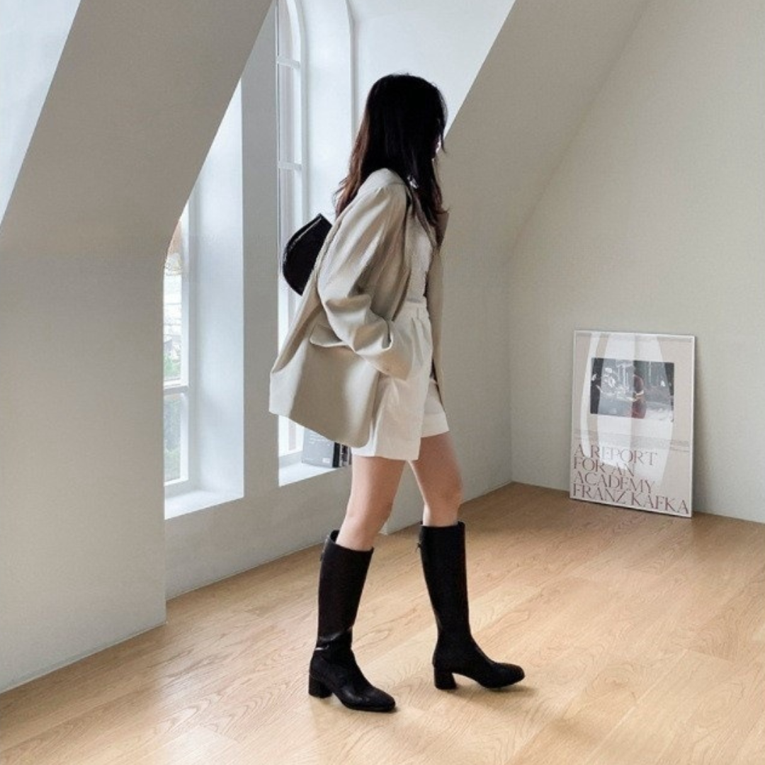Botas elegantes de cuero hasta la rodilla